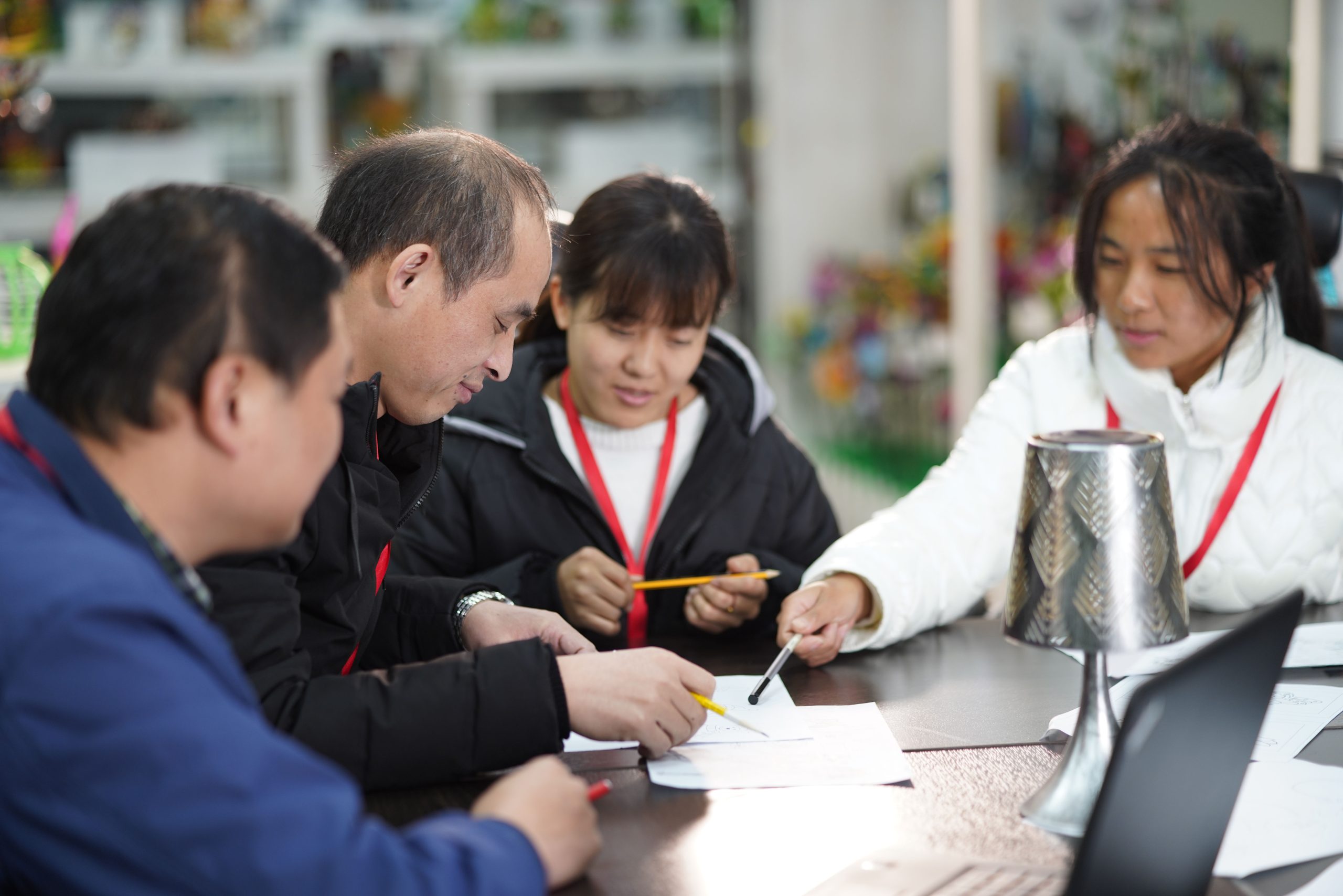 Team discussing custom garden decor product development
