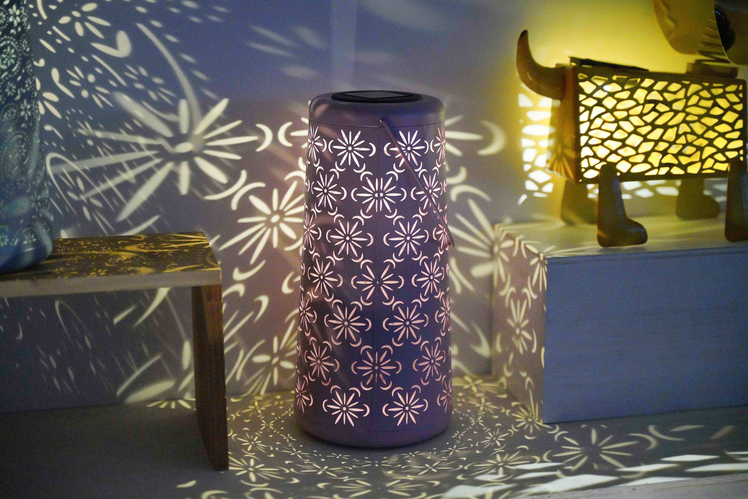 Metal solar garden lantern with cut-out projection effect