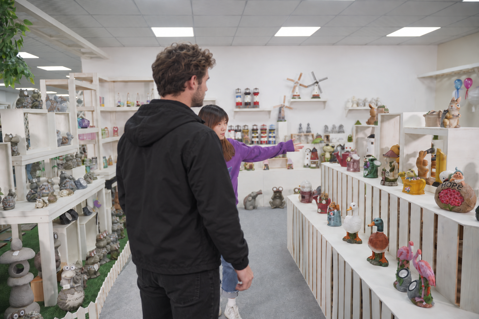 Hongjie team discussing garden decoration products in the showroom